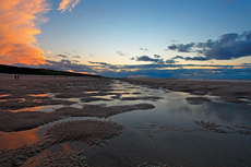 Wangerooge: Bei Ebbe bilden sich Gezeitentümpel auf dem Strand.